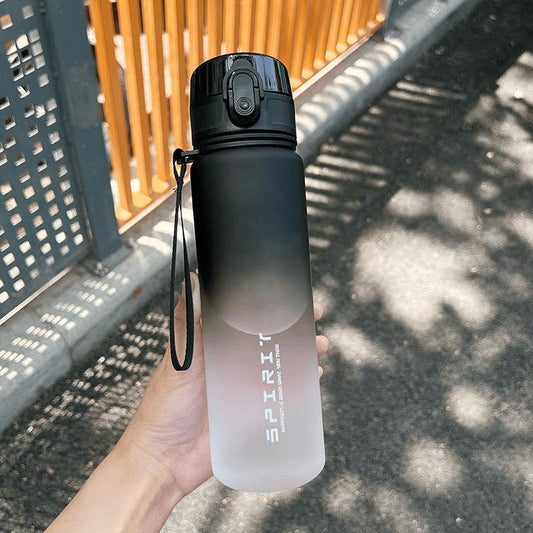 The sports water cup is made of plastic with a large capacity